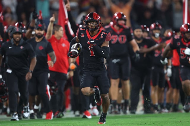 Chris Johnson #1 of the San Diego State Aztecs returns an interception for a touchdown during the second half of a game against the California Golden Bears at Snapdragon Stadium on September 20, 2025 in San Diego, California.