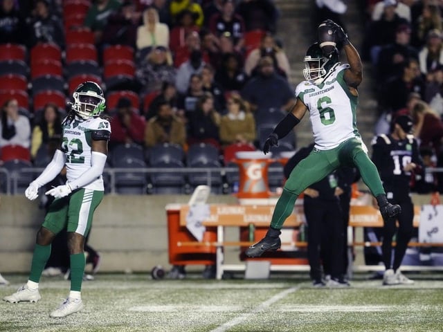 Saskatchewan Roughriders linebacker Jameer Thurman (6) celebrates an interception against the Ottawa Redblacks with teammate defensive back DaMarcus Fields (22) during second half CFL action in Ottawa, Friday, Oct. 3, 2025.