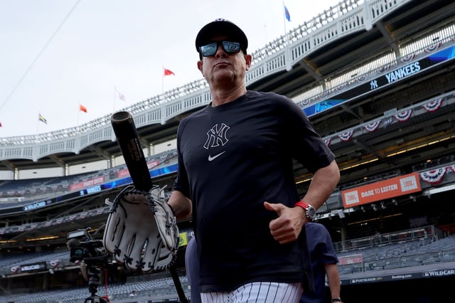 Sep 30, 2025; Bronx, New York, USA; New York Yankees manager Aaron Boone (17) watches batting practice before game one of the Wildcard round of the 2025 MLB playoffs against the Boston Red Sox at Yankee Stadium. Mandatory Credit: Brad Penner-Imagn Images
