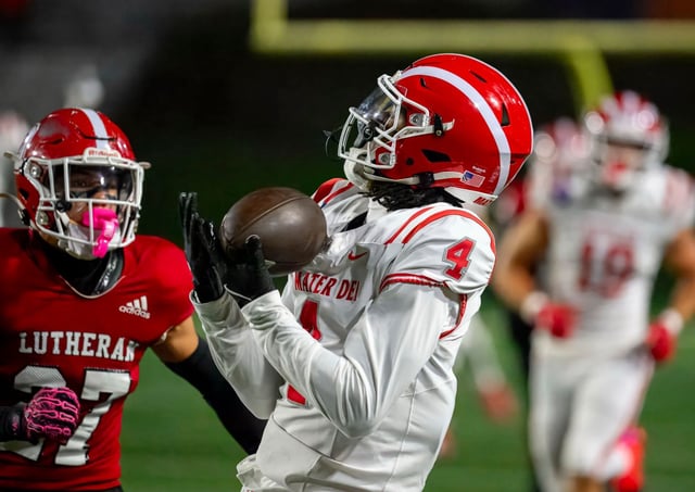 Mater Dei wide receiver Kayden Dixon-Wyatt, right, makes the over the shoulder catch in front of Orange Lutheran cornerback Matthew Zapien in a Trinity League football game in Costa Mesa on Friday, Oct. 3, 2025. (Photo by Paul Rodriguez, Contributing Photographer)