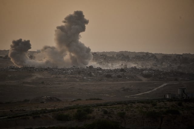 Smoke rises to the sky following an Israeli military strike in the northern Gaza Strip, as seen from southern Israel, Friday, Oct. 3, 2025. (AP Photo/Leo Correa)