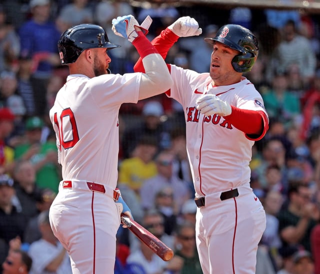 Alex Bregman, right, of the Boston Red Sox celebrates his homer with Trevor Story during the first inning of a MLB game in April against the Seattle Mariners at Fenway Park. (Photo By Matt Stone/Boston Herald)
