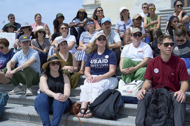 Laid-off federal workers, whose jobs were cut by President Donald Trump's Department of Government Efficiency, gather on the steps of the Capitol in Washington, June 10, 2025.