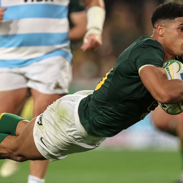 South Africa's fly-half Sacha Feinberg-Mngomezulu dives to score a try during the Rugby Championship Test match between South Africa and Argentina at Kings Park Stadium in Durban on September 27, 2025. 
