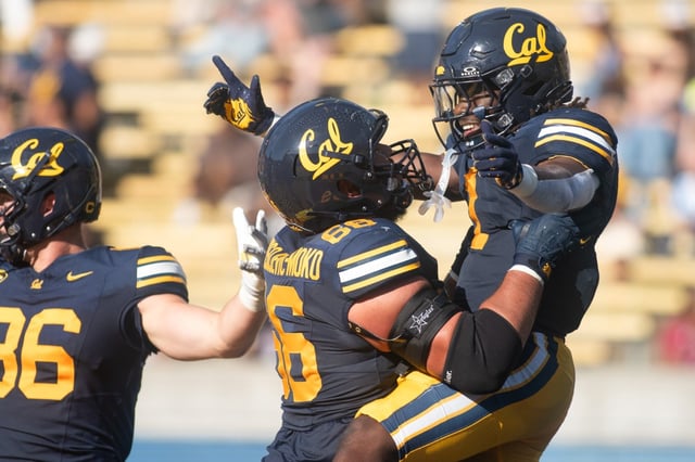 Cal’s Kendrick Raphael, right, is hoisted in the air by teammate Jordan Spasojevic-Moko after scoring a touchdown against Texas Southern in the second half at hosting Cal Berkeley in Berkeley, CA on Saturday, Sept. 6, 2025. (Don Feria for Bay Area News Group)