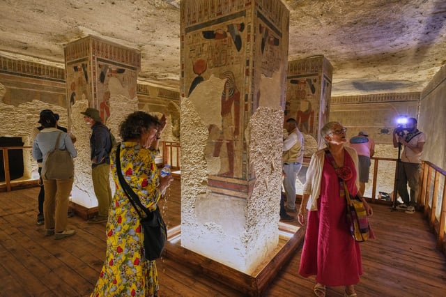 Visitors view the tomb of Amenhotep III, who ruled ancient Egypt between 1390 B.C. and 1350 B.C., in the Valley of Kings in the southern city of Luxor, Egypt, Saturday, Oct. 4, 2025, as it opened to visitors for the first time in more than two decades. (AP Photo/Amr Nabil)