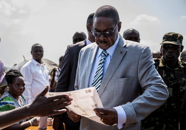 Malawi's presidential candidate and leader of the Democratic Progressive Party Peter Mutharika inspects a ballot paper before casting his vote during the general election at Thyolo District, south of Blantyre, Malawi, September 16, 2025. REUTERS/Stringer