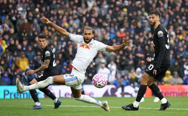 Soccer Football - Premier League - Leeds United v Tottenham Hotspur - Elland Road, Leeds, Britain - October 4, 2025 Leeds United's Dominic Calvert-Lewin in action with Tottenham Hotspur's Rodrigo Bentancur and Pedro Porro Action Images via Reuters/Andrew Boyers