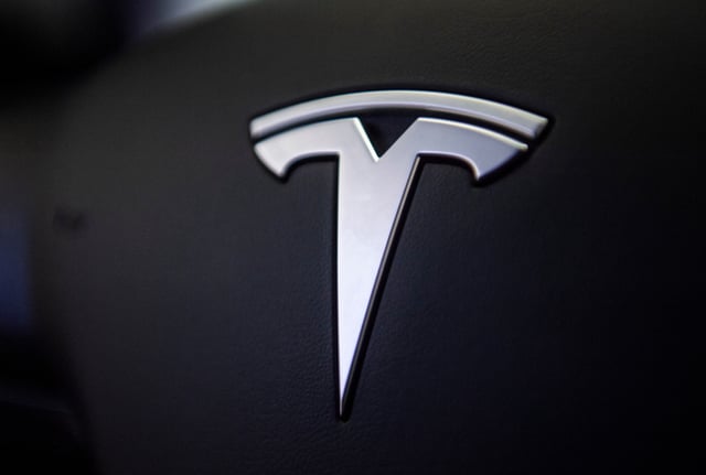14 November 2018, North Rhine-Westphalia, D'sseldorf: The logo can be seen on the steering wheel of Tesla's Model 3 electric car in a showroom. Tesla starts on 14.11.2018 with the presentation of the car in Europe. Photo by: Christophe Gateau/picture-alliance/dpa/AP Images