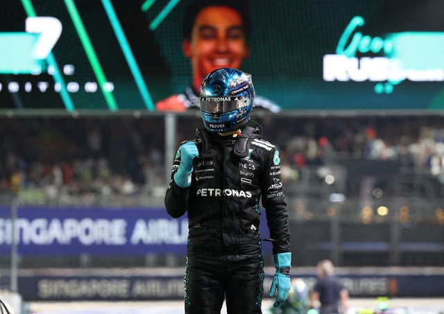 Formula One F1 - Singapore Grand Prix - Marina Bay Street Circuit, Singapore - October 4, 2025 Mercedes' George Russell celebrates after qualifying in pole position REUTERS/Athit Perawongmetha