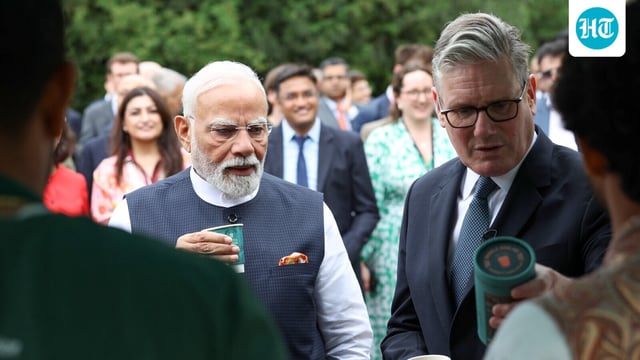 Prime Minister Narendra Modi and Prime Minister of the United Kingdom, Keir Starmer have tea during a business event following the signing of the historic India-UK Comprehensive Economic and Trade Agreement [CETA], in London in July.