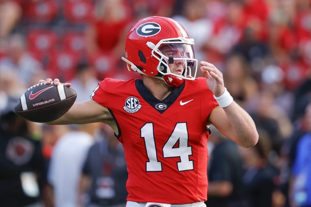 Gunner Stockton #14 of the Georgia Bulldogs warms up prior to the game against the Alabama Crimson Tide at Sanford Stadium on September 27, 2025 in Athens, Georgia.