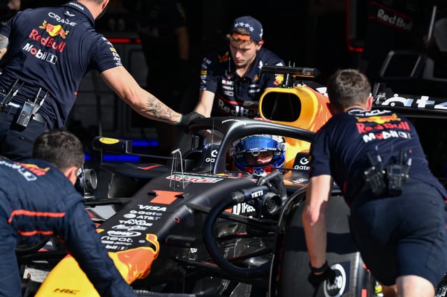 Red Bull Racing's Dutch driver Max Verstappen sits in his car flanked by team mechanics in the pit during the qualifying session ahead of the Italian Formula One Grand Prix at the Autodromo Nazionale Monza circuit, in Monza, northern Italy, on September 6, 2025. (Photo by Marco BERTORELLO / POOL / AFP) (Photo by MARCO BERTORELLO/POOL/AFP via Getty Images)