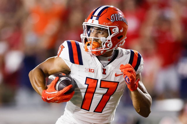 Alexander Capka-Jones #7 of the Illinois Fighting Illini catches and runs for a touchdown against the Indiana Hoosiers in the first half at Memorial Stadium on September 20, 2025 in Bloomington, Indiana.