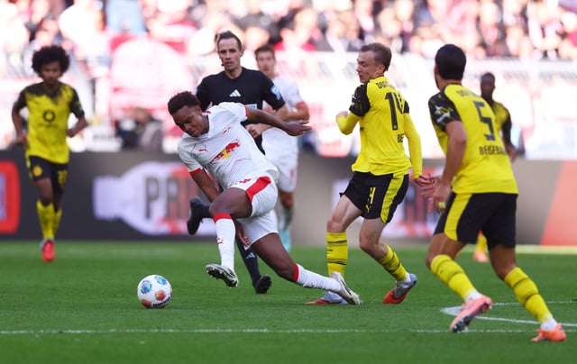 Soccer Football - Bundesliga - Borussia Dortmund v RB Leipzig - Signal Iduna Park, Dortmund, Germany - October 4, 2025 RB Leipzig's Assan Ouedraogo in action with Borussia Dortmund's Maximilian Beier REUTERS/Thilo Schmuelgen