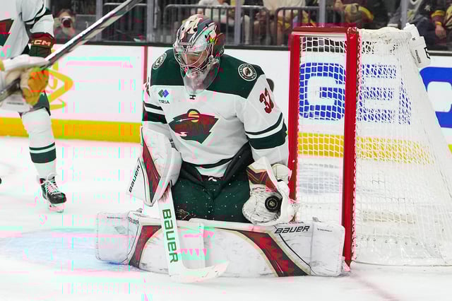 Apr 29, 2025; Las Vegas, Nevada, USA; Minnesota Wild goaltender Filip Gustavsson (32) makes a save against the Vegas Golden Knights during the second period of game five of the first round of the 2025 Stanley Cup Playoffs at T-Mobile Arena. Mandatory Credit: Stephen R. Sylvanie-Imagn Images