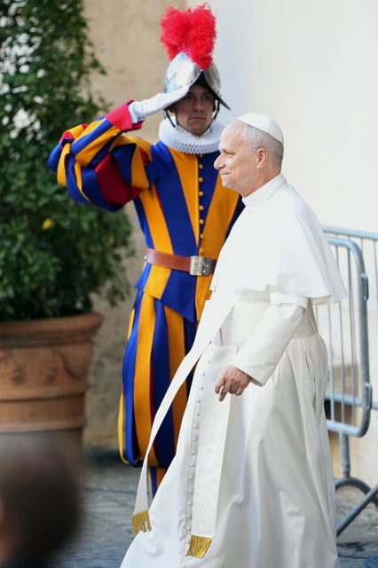 Pope Leo XIV attends the swearing in ceremony of 27 Pontifical Swiss Guards cadets in the St. Damasus Courtyard at the Vatican, Saturday, Oct. 4, 2025. (AP Photo/Andrew Medichini)
