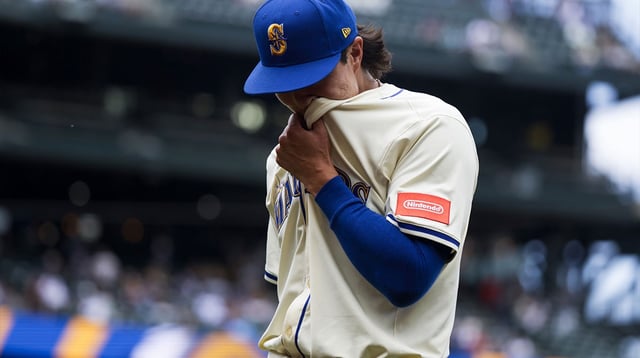 Jul 20, 2025; Seattle, Washington, USA; Seattle Mariners starting pitcher Bryan Woo (22) returns to the dugout following the final out of the top of the fifth inning at T-Mobile Park. Mandatory Credit: Joe Nicholson-Imagn Images.
