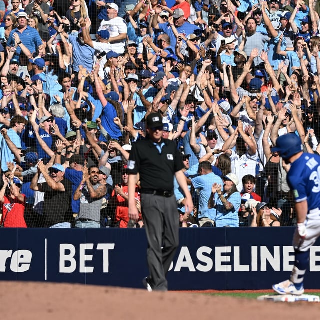 Fans celebrate as catcher Alejandro Kirk rounds the bases after hitting a grand slam home run against the Tampa Bay Rays in the first inning at Rogers Centre, on Sept. 28.