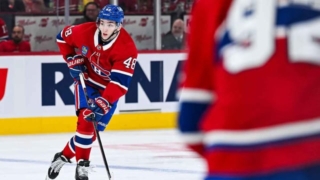 Apr 14, 2025; Montreal, Quebec, CAN; Montreal Canadiens defenseman Lane Hutson (48) plays the puck against the Chicago Blackhawks in the second period at Bell Centre. Mandatory Credit: David Kirouac-USA TODAY Sports