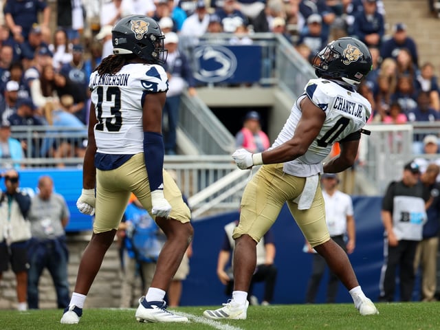 Johnny Chaney Jr. #0 of the FIU Panthers reacts with Dante Anderson #13 of the FIU Panthers after a play during the third quarter against the Penn State Nittany Lions at Beaver Stadium on September 6, 2025 in State College, Pennsylvania.