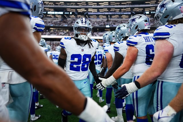 Malik Hooker #28 of the Dallas Cowboys runs out of the tunnel prior to an NFL football game against the New York Giants at AT&T Field on September 14, 2025 in Arlington, Texas.