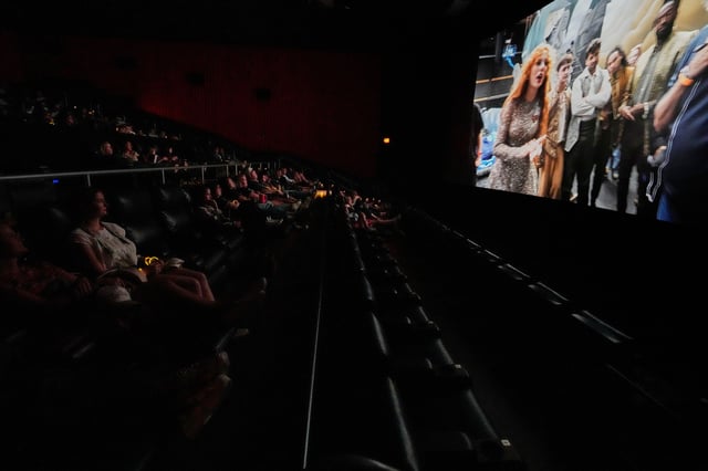 Fans watch a release party film for Taylor Swift's new album "The Life of a Showgirl" at a movie theater Friday, Oct. 3, 2025, in Nashville, Tenn. (AP Photo/George Walker IV)