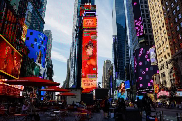 A billboard advertises "The Official Release Party of a Showgirl," a movie celebrating Taylor Swift's new album "The Life of a Showgirl," in Times Square, New York City, on October 3, 2025.