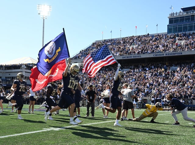 The Midshipman run onto the field. The Navy Midshipmen host the visiting Air Force Falcons for a NCAA football game at Navy-Marine Corps Memorial Stadium in Annapolis. (Paul W. Gillespie/Staff)
