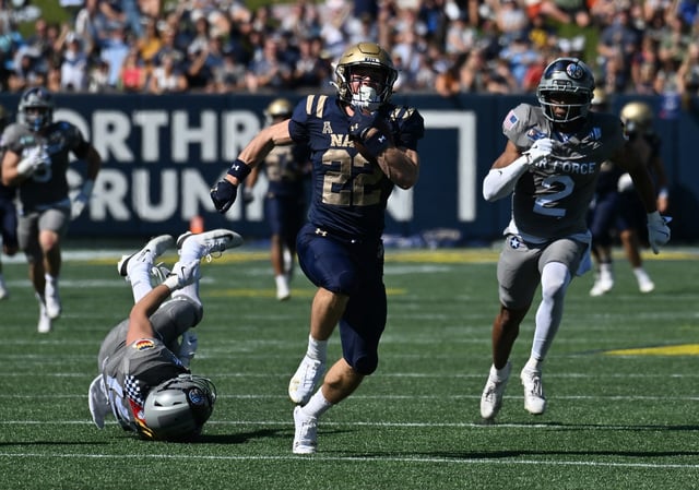Navy slotback Eli Heidenreich scores on a big catch and run in the second quarter. The Navy Midshipmen host the visiting Air Force Falcons for a NCAA football game at Navy-Marine Corps Memorial Stadium in Annapolis. (Paul W. Gillespie/Staff)