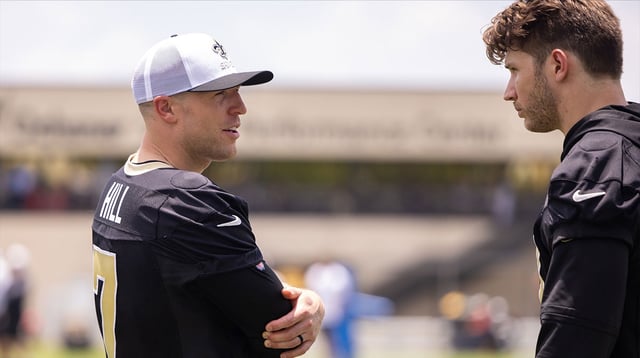 Jun 10, 2025; New Orleans, LA, USA; New Orleans Saints tight end Taysom Hill (7) talks with tight end Foster Moreau (87) during minicamp at Ochsner Sports Performance Center.