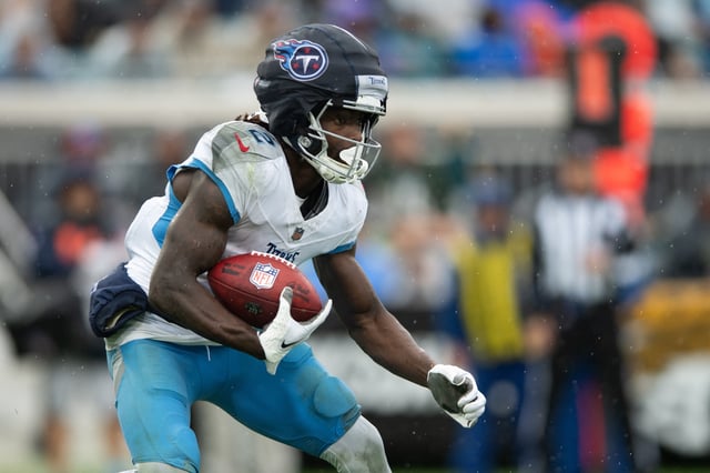 Dec 29, 2024; Jacksonville, Florida, USA; Tennessee Titans running back Tyjae Spears (2) runs the ball against the Jacksonville Jaguars in the first quarter at EverBank Stadium. Mandatory Credit: Jeremy Reper-Imagn Images/File Photo