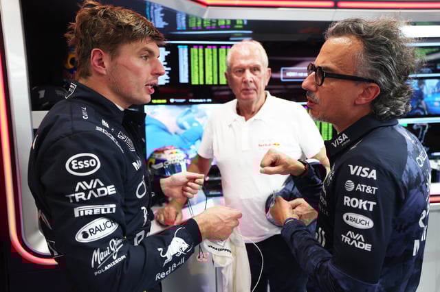 SINGAPORE, SINGAPORE - OCTOBER 03: Max Verstappen of the Netherlands and Oracle Red Bull Racing and Laurent Mekies, Team Principal of Oracle Red Bull Racing talk in the garage during practice ahead of the F1 Grand Prix of Singapore at Marina Bay Street Circuit on October 03, 2025 in Singapore, Singapore. (Photo by Mark Thompson/Getty Images)