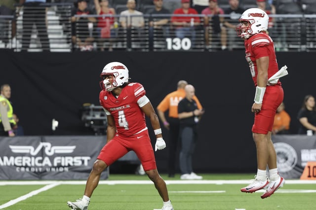 DeAngelo Irvin Jr. #4 and Anthony Colandrea #10 of the UNLV Rebels celebrate after their team's 30-23 victory against the UCLA Bruins at Allegiant Stadium on September 06, 2025 in Las Vegas, Nevada.