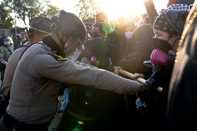 Police clash with demonstrators during a protest outside an immigrant processing and detention center on October 03, 2025 in Broadview, Illinois. The site has been the target of frequent protests as federal law enforcement agents continue Operation Midway Blitz in the Chicago area, an operation designed to apprehend and deport undocumented immigrants living in the area.
