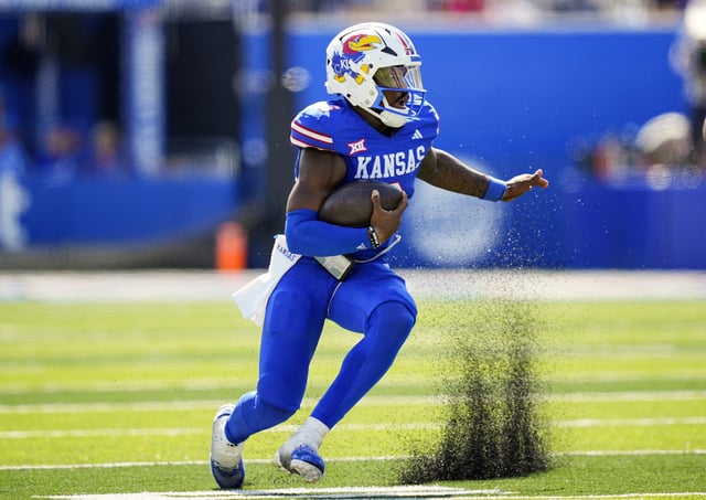 Jalon Daniels #6 of the Kansas Jayhawks runs the ball during the second half against the Cincinnati Bearcats at David Booth Kansas Memorial Stadium on September 27, 2025 in Lawrence, Kansas
