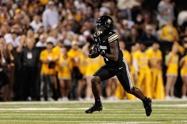 Omarion Miller #4 of the Colorado Buffaloes runs with the ball during the first half against the Wyoming Cowboys at Folsom Field on September 20, 2025 in Boulder, Colorado.