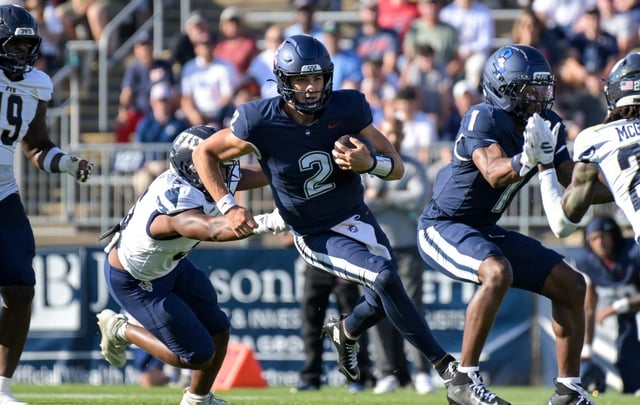 UConn quarterback Joe Fagnano scrambles for first-half yardage during the Huskies' win over FIU on Saturday, Oct. 4, 2025 at Rentschler Field. (Courtesy of UConn)