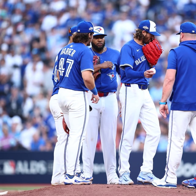 TORONTO, ONTARIO - OCTOBER 04: Manager John Schneider #14 of the Toronto Blue Jays removes Kevin Gausman #34 from the sixth inning of game one of the Division Series against the New York Yankees at Rogers Centre on October 04, 2025 in Toronto, Ontario. (Photo by Vaughn Ridley/Getty Images)