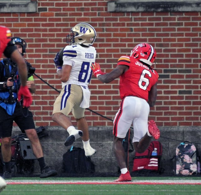 Washington’s Dezmen Roebuck, left, catches a touchdown against Maryland’s Dontay Joyner, right, in the fourth quarter at SECU Stadium. (Kenneth K. Lam/staff)