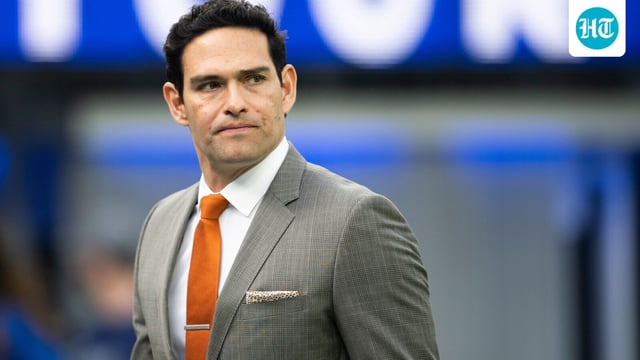 Mark Sanchez walks on the field before an NFL football game between the Los Angeles Rams and the Jacksonville Jaguars