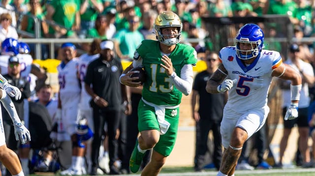 Oct 4, 2025; South Bend, Indiana, USA; Notre Dame Fighting Irish quarterback CJ Carr (13) runs the ball against the Boise State Broncos during the first half at Notre Dame Stadium. Mandatory Credit: Michael Caterina-Imagn Images