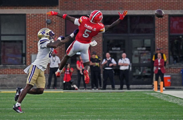 Maryland’s Octavian Smith Jr., right, cannot catch this over thrown ball on fourth down against Washington’s Leroy Bryant, left, in the fourth quarter at SECU Stadium. (Kenneth K. Lam/staff)