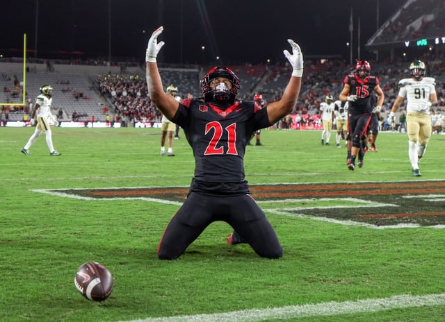 San Diego State running back Byron Cardwell Jr. celebrates his 20-yard touchdown run in the fourth quarter against Colorado State at Snapdragon Stadium. (Hayne Palmour IV / For The San Diego Union-Tribune)