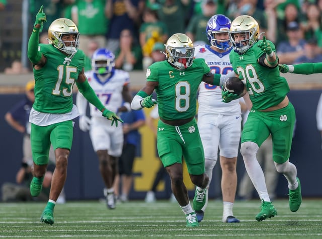 Notre Dame's Leonard Moore (15), Adon Shuler (8) and Luke Talich celebrate after an interception during the second half against Boise State on Oct. 4, 2025, in South Bend, Ind. (Michael Hickey/Getty Images)
