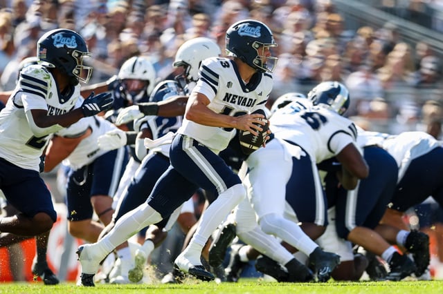 Chubba Purdy #13 of the Nevada Wolf Pack scrambles against the Penn State Nittany Lions during the first half at West Shore Home Field at Beaver Stadium on August 30, 2025 in State College, Pennsylvania.