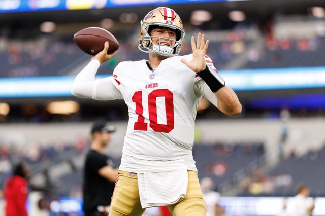 Mac Jones #10 of the San Francisco 49ers warms up prior to an NFL football game against the Los Angeles Rams at SoFi Stadium on October 02, 2025 in Inglewood, California.