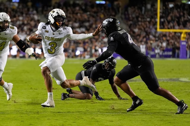 Colorado quarterback Kaidon Salter (3) sprints to the end zone for a touchdown after getting past TCU linebacker Namdi Obiazor (4) in the first half of an NCAA college football game Saturday, Oct. 4, 2025, in Fort Worth, Texas. (AP Photo/Tony Gutierrez)
