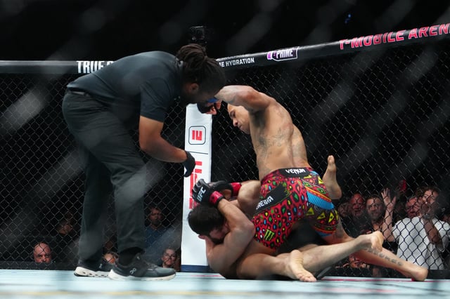 Oct 4, 2025; Las Vegas, Nevada, UNITED STATES; Magomed Ankalaev (red gloves) fights Alex Pereira (blue gloves) during UFC 320 at T-Mobile Arena. Mandatory Credit: Stephen R. Sylvanie-Imagn Images