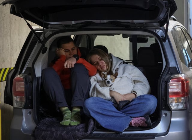 People take shelter inside underground parking during Russian drone and missile strikes in Lviv. (Picture: Roman Baluk/Reuters)